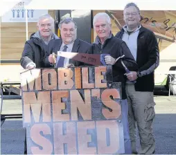  ??  ?? Friendship Cllr Jim Mcguigan (second from left) with Men’s Shed members Charles Lambert, David White and Jim Gallacher