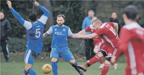  ??  ?? Action from the Durham Sunday Cup clash between The Shack (blue) and Southwick.