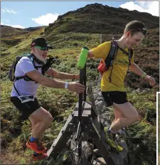  ?? Photos by Valerie O’Sullivan ?? James Morrissey hot on the heels of Tom Downes, as they crest one of the many stiles along the Kerry Way. RIGHT: Anthony O’Sullivan and John Kinsella.