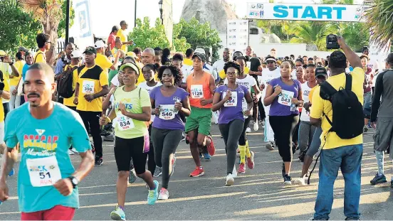  ??  ?? Competitor­s get going at the recent Jamaica National Foundation-Usain Bolt Foundation Heroes in Action 8K Run-Walk and 4K Fun Run in Falmouth, Trelawny.