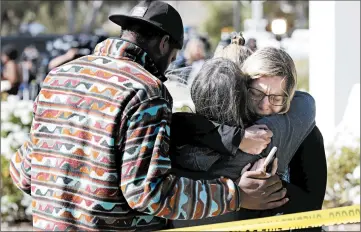  ?? MARCIO JOSE SANCHEZ/AP ?? Mourners gather at a community teen center Thursday, hours after the mass shooting in Thousand Oaks, Calif.