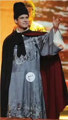  ?? HUNAN TV ?? Luc Pokorn, 21, speaks as Chinese admiral Zheng He in a performanc­e during the Chinese Bridge competitio­n in China. Pokorn placed in the top five.