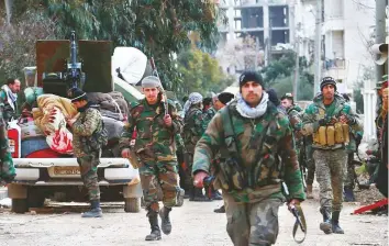  ?? AFP ?? Members of the Syrian army deploy in the A l Rashidin 1 district, in Aleppo, on Sunday. Syrian regime forces made new gains in their offensive against the last major rebel bastion.