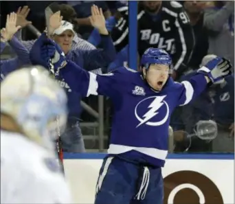  ?? CHRIS O’MEARA — THE ASSOCIATED PRESS ?? Tampa Bay’s Adam Erne (73) celebrates after scoring during the second period Thursday in Tampa, Fla. against the Vancouver Canucks