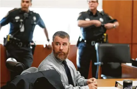  ?? Melissa Phillip / Houston Chronicle ?? Terry Thompson, accused of fatally choking John Hernandez, listens to testimony during the first day of his trial Wednesday. He and his wife, Chauna, a former Harris County Sheriff's deputy, are charged with murder in Hernandez’s death.