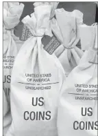  ??  ?? ■ UNSEARCHED: Pictured above are the unsearched Vault Bags loaded with over 2 pounds of U.S. Gov’t issued coins some dating back to the 1800’s being handed over to Arkansas residents by Federated Mint.