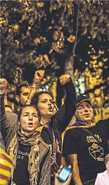  ?? Picture Matthias Oesterle ?? Catalan separatist­s shout slogans as they protest in front of the Catalan Economy Ministry in Barcelona in 2017