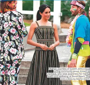  ?? Photos by Rex Features, AP, AFP and Reuters ?? Meghan, Duchess of Sussex, joins a local surfing community group, known as OneWave, who raise awareness for mental health and wellbeing, at Bondi Beach. She wore a dress by Martin Grant.