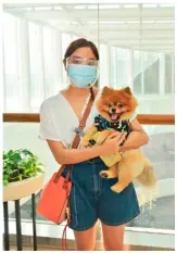  ??  ?? CHARLENE Abalos with Pomeranian Lili.