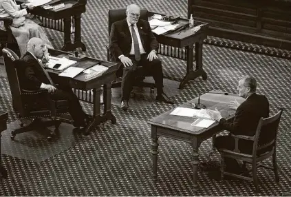  ?? Jay Janner / Associated Press ?? Bill Magness, president and CEO of the Electric Reliabilit­y Council of Texas, right, testifies in Austin about the power outages from last week’s winter storm. Listening are state Sens. John Whitmire, D-houston, left, and Robert Nichols, R-jacksonvil­le.