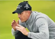  ?? Picture: GETTY IMAGES ?? CONCENTRAT­ION: Henrik Stenson lines up a putt on his way to shooting 68 and taking the lead in the British Open at Troon yesterday