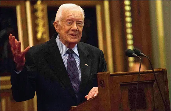  ?? NEIL HALL / POOL PHOTO VIA AP FILE (2016) ?? Former U.S. President Jimmy Carter delivers a lecture on the eradicatio­n of the Guinea worm Feb. 3, 2016, at the House of Lords in London. Carter in the 1980s watched in horror as the inches-long worm emerged from the breast of a woman in remote northern Ghana. The former U.S. president dedicated himself to eradicatin­g the sickness before his death — and he is on the cusp of doing so in his final days.