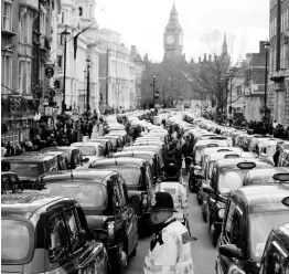  ?? FILE ?? In this Wednesday, February 10, 2016 photo, London taxis block the roads during a protest in central London, concerned with unfair competitio­n from services such as Uber. London’s transit operator says it is not renewing Uber’s licence to operate in the British capital. Uber’s licence expires Monday, November 25, 2019.