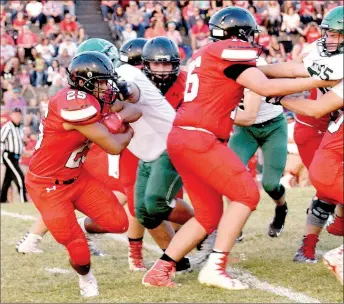  ?? RICK PECK/MCDONALD COUNTY PRESS ?? McDonald County running back Isrrael De Santiago runs behind offensive lineman Will Gordon for some of his 95 rushing yards in the Mustangs’ 43-21 loss to Mount Vernon on Sept. 15 at MCHS.