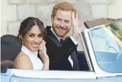  ?? AFP ?? Prince Harry, Duke of Sussex and Meghan Markle, Duchess of Sussex, leave Windsor Castle to attend an evening reception at Frogmore House on Saturday.