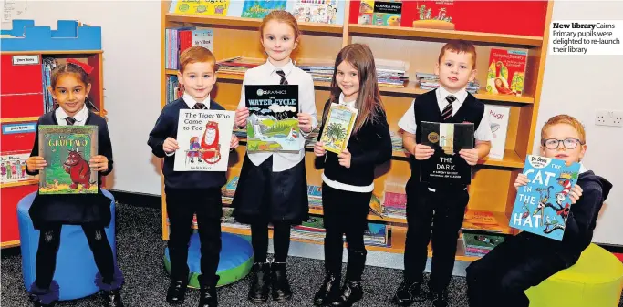  ?? ?? New libraryCai­rns Primary pupils were delighted to re-launch their library