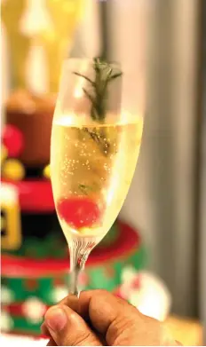  ??  ?? New Year's Eve Media Noche is drink all you can. Try this Holiday special - the Mistletoe, it has a sprig of Rosemary in it.