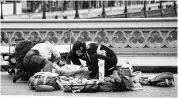  ?? PHOTO: REUTERS ?? Emergency services respond after the terror incident (top). Paramedics treat an injured person on Westminste­r Bridge in London on Wednesday