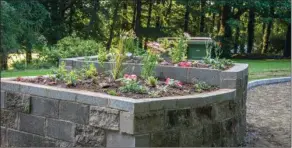  ??  ?? Raised flower bed made from recycled cavity blocks which was planted in June.