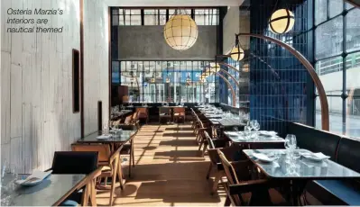  ??  ?? Osteria Marzia’s interiors are nautical themed Osteria Marzia is part of a new trend, where classic dishes from heritage
cuisines are transplant­ed into sleek, hipper-than
thou settings