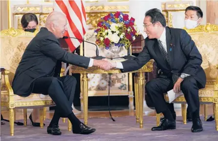  ?? EVAN VUCCI/AP ?? Japanese Prime Minister Fumio Kishida, right, hosts President Joe Biden on Monday at Akasaka Palace in Tokyo.