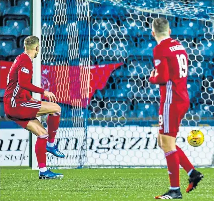  ??  ?? SPOT ON: Sam Cosgrove, left, scores to make it 3-3 in extra time during Aberdeen’s Scottish Cup fifth-round replay