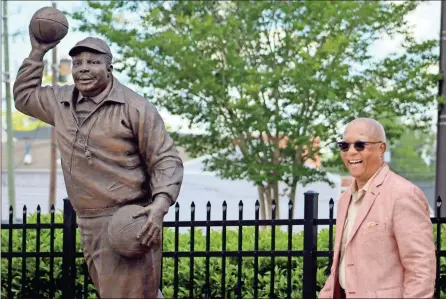  ?? Jeremy Stewart ?? Cedar Hill High School alum Ed Weaver reacts after helping unveil the statue of former coach Escue Rodgers at the Polk County Sports Walk of Fame on Saturday, July 2, 2022. Rodgers made a reputation for himself as one of the top coaches in the state during his time at CHHS and was inducted into the Georgia Sports Hall of Fame in 2021.