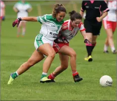  ??  ?? Tinahely’s Sarah Byrne collides with Moorefield’s Emma Harney.