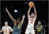  ?? STEPH CHAMBERS — GETTY IMAGES ?? USC freshman star JuJu Watkins, who scored 30points, shoots over Baylor's Yaya Felder in Saturday's win.