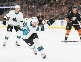  ?? Jae C. Hong / Associated Press ?? Melker Karlsson follows through on a shot that resulted in a third-period goal in San Jose’s fifth win in nine days. The Sharks have climbed to second place in the Pacific Division.