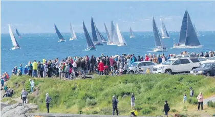  ??  ?? Spectators watch the start of last year’s Swiftsure Internatio­nal Yacht Race from Clover Point.