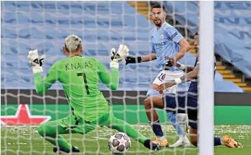  ?? (AFP) ?? Manchester City's Riyad Mahrez (C) scores against PSG during the Champions League second-leg semifinal in Manchester, UK, on Tuesday