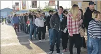  ?? DESIREE ANSTEY/JOURNAL PIONEER ?? A growing line of excited Travis Tritt fans at Summerside’s Credit Union Place Saturday evening.