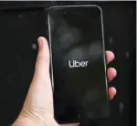  ?? — Reuters ?? Uber’s logo is displayed on a mobile phone in London, Britain.