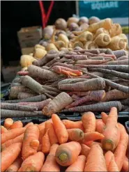  ?? KATIE WORKMAN — THE ASSOCIATED PRESS ?? Root vegetables are displayed at the Union Square Farmers Market in New York on Jan. 8.