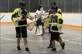  ?? NEWS PHOTO RYAN MCCRACKEN ?? Medicine Hat Sun Devils Aidan McLean (23), Izaak Loran (right) and Zach Wilson (behind) celebrate after scoring a goal in Saturday's Rocky Mountain Lacrosse League junior B Tier 2 game against the Calgary Sabrecats at the Kinplex.