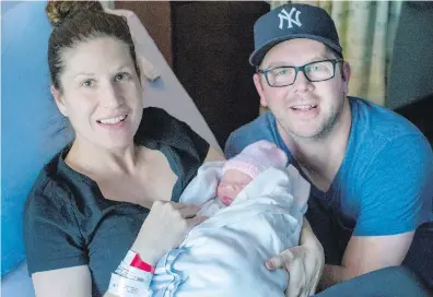  ??  ?? Elaine and Rob Tuit with the region’s first baby of the new year, Hallie Rae Tuit, at Victoria General Hospital on Monday.