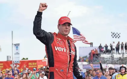  ?? PAUL SANCYA/AP ?? Will Power celebrates Sunday after winning the IndyCar Detroit Grand Prix on Belle Isle in Detroit. Power held off Alexander Rossi in the closing laps for his first victory of the season.