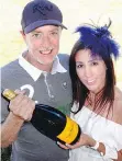  ??  ?? As Pacific Polo Cup temperatur­es rose, Craig Stowe relieved coorganize­r Nadia Iadisernia by running for another $10,000 worth of Champagne.