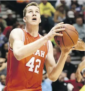  ?? ETHAN MILLER / GETTY IMAGES ?? Jakob Poeltl of the Utah Utes drives to the basket during NCAA Tournament action last season. Poeltl is being projected as a potential pick for the Toronto Raptors heading into Thursday’s draft.