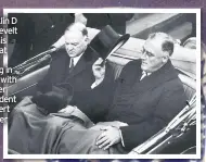  ??  ?? Franklin D Roosevelt tips his top hat while sitting in a car with former President Herbert Hoover