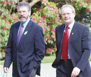  ??  ?? Files photo shows McGuinness (right) and Adams arrive at Hillsborou­gh Castle in Northern Ireland on April 8, 2003. — AFP photo