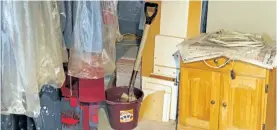  ?? DET. CONST. RYAN DONALDSON/PETERBOROU­GH ?? A shovel sitting in a bucket of what appeared to be bleach is seen in Andrew Watson's basement of his home on Payne Street in November 2014.