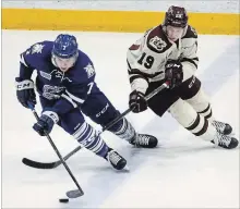  ?? CLIFFORD SKARSTEDT EXAMINER ?? Petes’ Semyon Der-Arguchints­ev pokes the puck away from Steelheads’ Michael Little during OHL action Dec. 29 at the Memorial Centre. The Petes swung a trade for Little before Thursday’s OHL trade deadline.