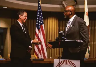  ?? Stephen Lam / The Chronicle ?? Matt Wayne (left) shakes hands with San Francisco Unified School District Superinten­dent Vincent Matthews during a news conference announcing Wayne as the sole finalist for the job.