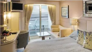  ??  ?? A stateroom aboard the Symphony, one of two ships operated by Crystal Cruises.