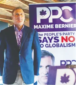  ?? JASON FRANSON / THE CANADIAN PRESS ?? People’s Party of Canada Leader Maxime Bernier waits to
speak at a rally Sunday in Vegreville, Alta.