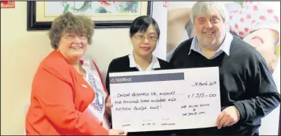  ??  ?? Vicki Dolphin, left, chairman of Hinckley and District Cancer Research UK (CRUK) committee, received a cheque for £1,315 from Louise Lam and Allan Smith who organised and hosted a fundraisin­g event for the charity at The Royal Dragon Cantonese...