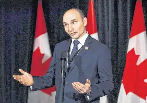  ?? CP PHOTO ?? Social Developmen­t Minister Jean-Yves Duclos speaks to reporters at a Liberal cabinet retreat in Calgary on January 24, 2017. The Trudeau government is facing calls to produce its long-awaited plan to help homeless veterans in Canada, after their...