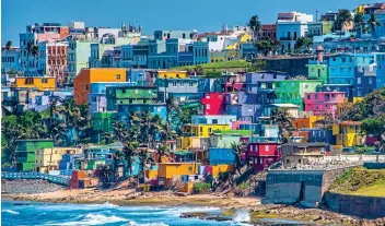  ?? ?? COLOURFUL CULTURE: Beachfront houses in San Juan, the capital of Puerto Rico